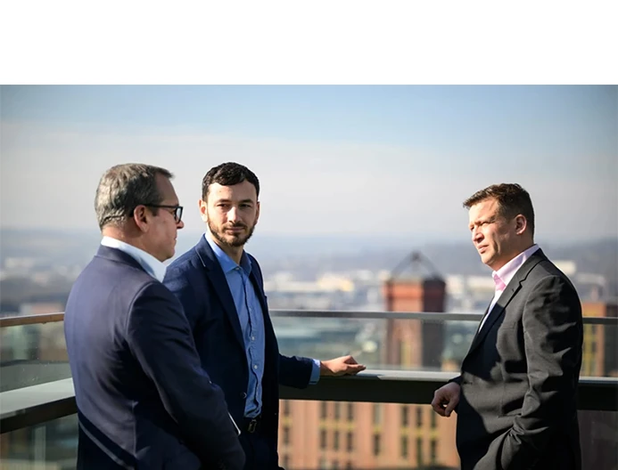 Sales Team Talking On Roof Terrace