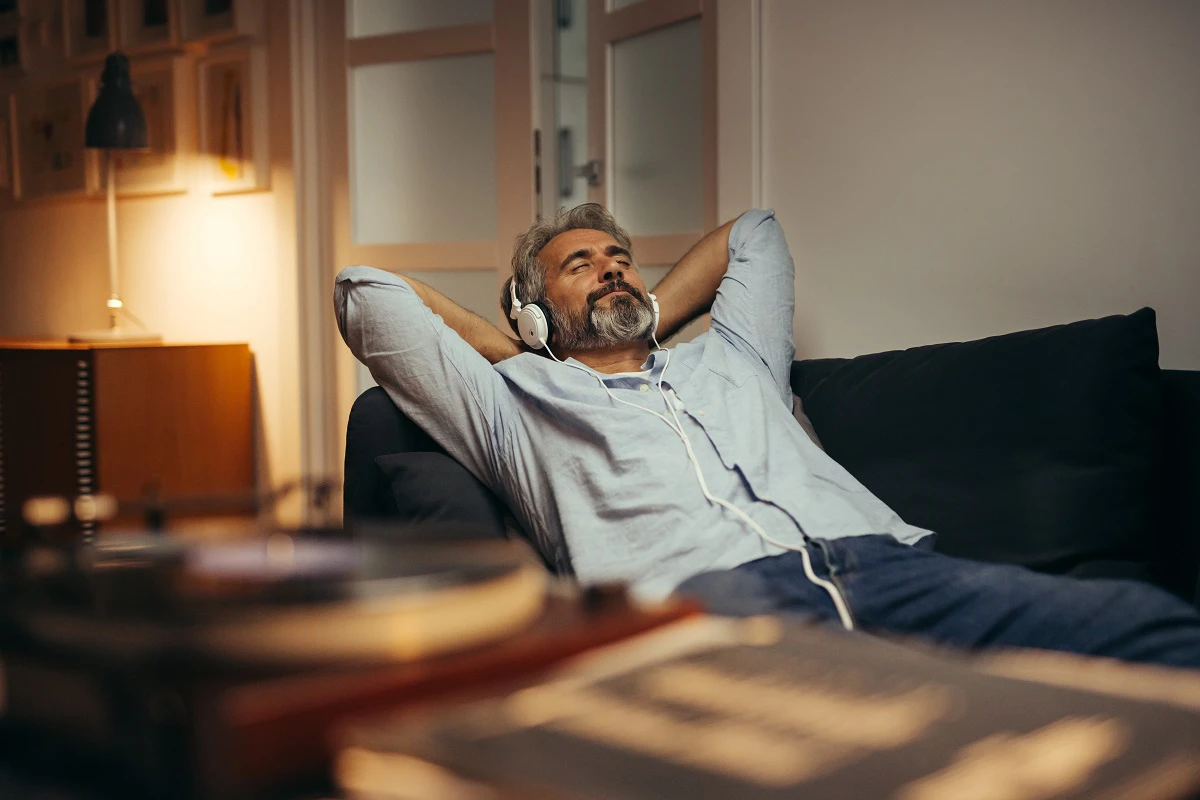 Older Man Relaxing On Sofa