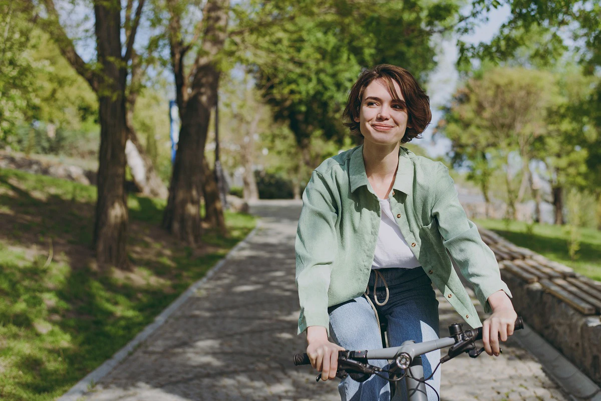 Young Woman On Bike Smiling