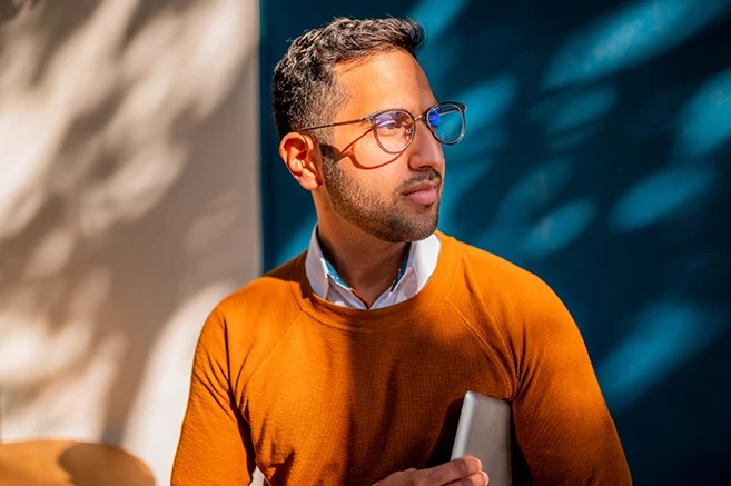 Man outside with orange jumper