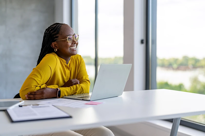 Lady sat at desk with laptop