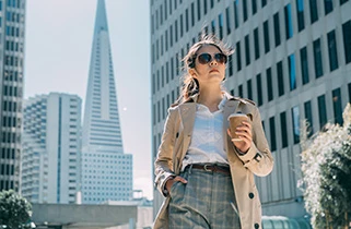 Business woman walking through the city