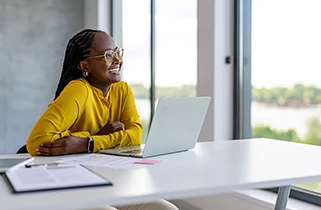 Lady sat at desk with laptop